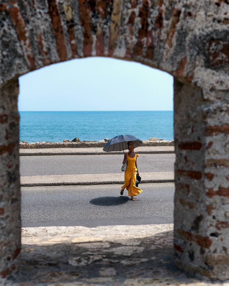 Girl with an umbrella in Cartagena Colombia.